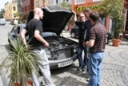 boys looking at cars